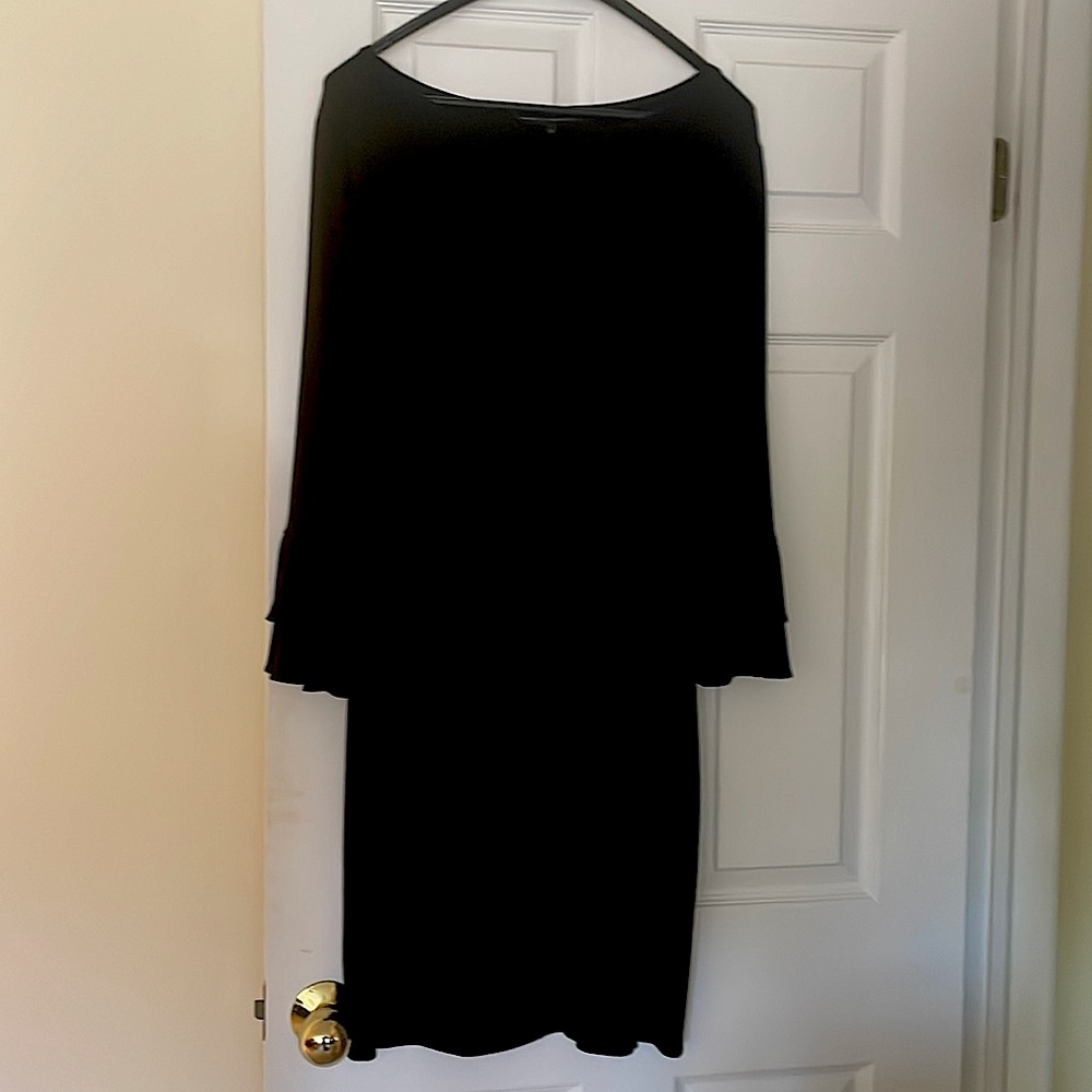 Comfortable stretch fabric with beautiful bell sleeves. Black dress.